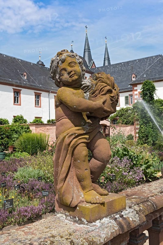 Figure sculpture statue in the monastery garden of St. Marcellinus and Peter in Seligenstadt, Germany, Europe