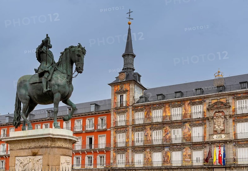 Madrid, Spain, 6 April, 2024: statue of Felipe II and the landmark buildings of the Plaza Mayor city square in downtown Madrid, Europe