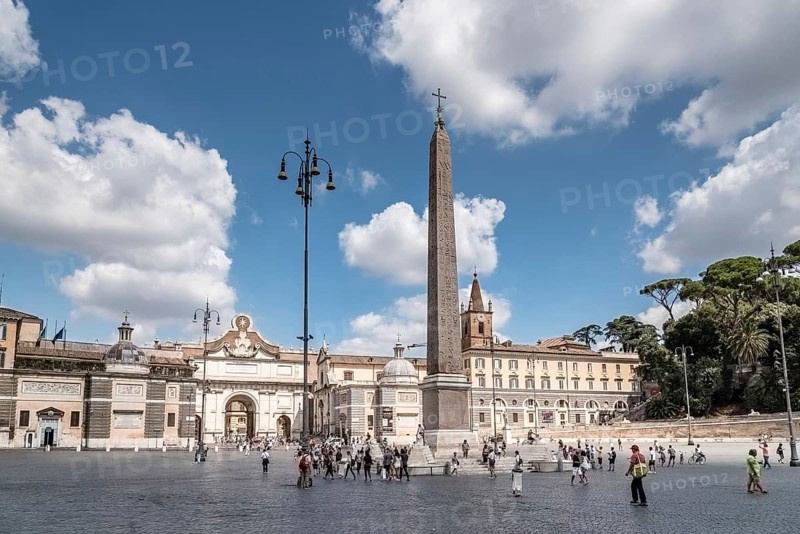 Rome, Italy, August 18, 2016: Tourists in Piazza del Popolo a sunny day of summer. It is a large urban square in Rome with an egyptian obelisk standing in the centre, Europe