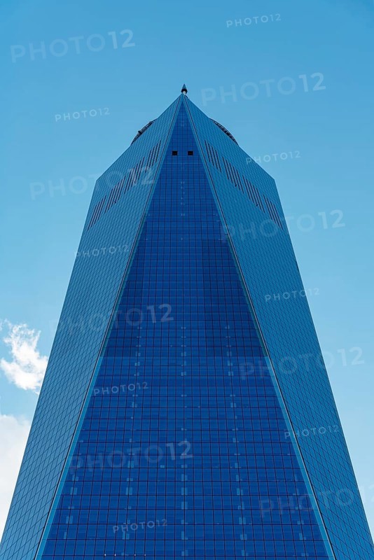 New York City, USA, June 20, 2018: Low angle view of One World Trade Center in New York. Vertical shot against blue sky. Business, Finance and Technology, North America