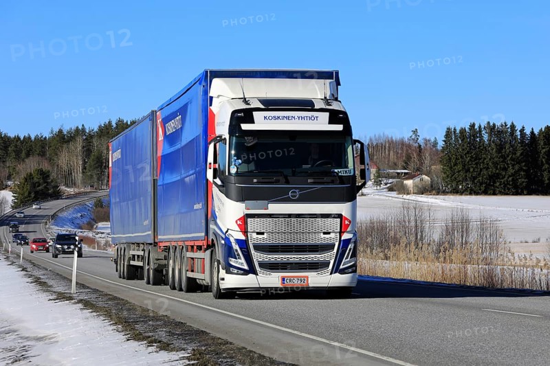 New Volvo FH truck Koskinen Yhtiot pulls freight trailer along highway 52 on a day of spring. Salo, Finland. March 9, 2023