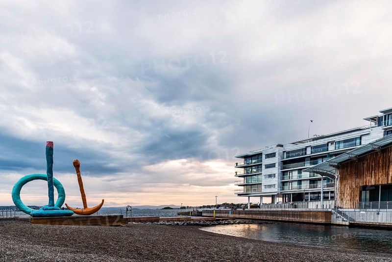 Oslo, Norway, August 11, 2019: Scenic view of sunset on Tjuvholmen quarter a new modern urban renewal with luxury housing in Central Oslo, Europe