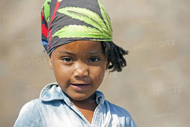 Close up portrait of Creole girl wearing headscarf on the island of Santiago, Cape Verde, Cabo Verde, Western Africa, Africa