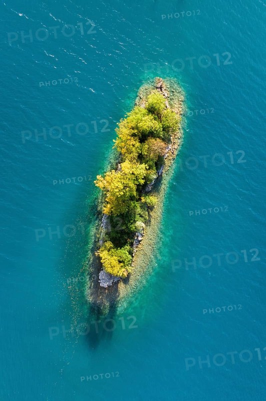 Bird's eye view of the chive island in the turquoise waters of Lake Walen in the canton of St. Gallen, Switzerland, Europe