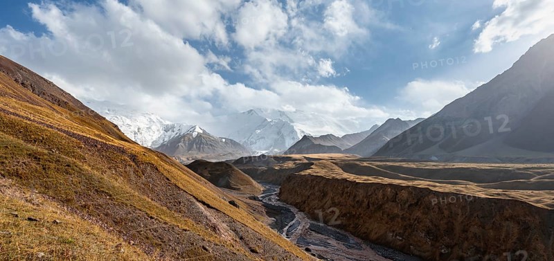 Valley with river Achik Tash between high mountains, mountain landscape with glaciated peak Pik Lenin, Trans Alay Mountains, Pamir Mountains, Osh Province, Kyrgyzstan, Asia