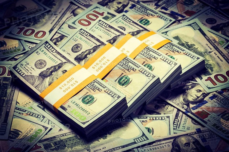 Creative business finance making money concept. Vintage retro effect filtered hipster style image of background of of new 100 US dollars 2013 edition banknotes bills bundles close up