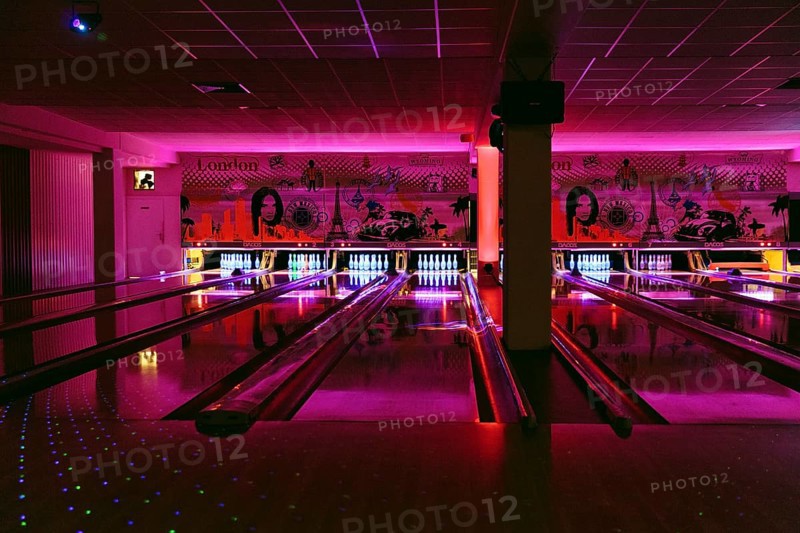Colourfully illuminated bowling alley, bowling centre, interior, Germany, Europe