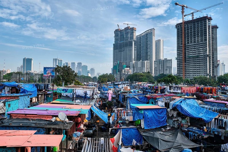 MUMBAI, INDIA, OCTOBER 31, 2019: Dhobi Ghat (Mahalaxmi Dhobi Ghat) is open air laundromat lavoir in Mumbai, India with laundry drying on ropes. Now signature landmark tourist attractions of Mumbai