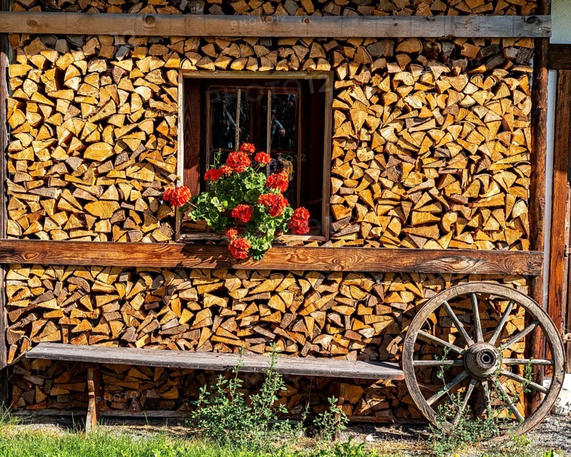 Wooden pile with flower deco, Going am Wilden Kaiser, Tyrol, Kufstein, Wilder Kaiser, Austria, Europe