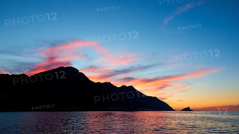 Blue evening sky, pink illuminated clouds, rocky coast, sunset, dusk, Marettimo, Egadi Islands, Sicily, Italy, Europe