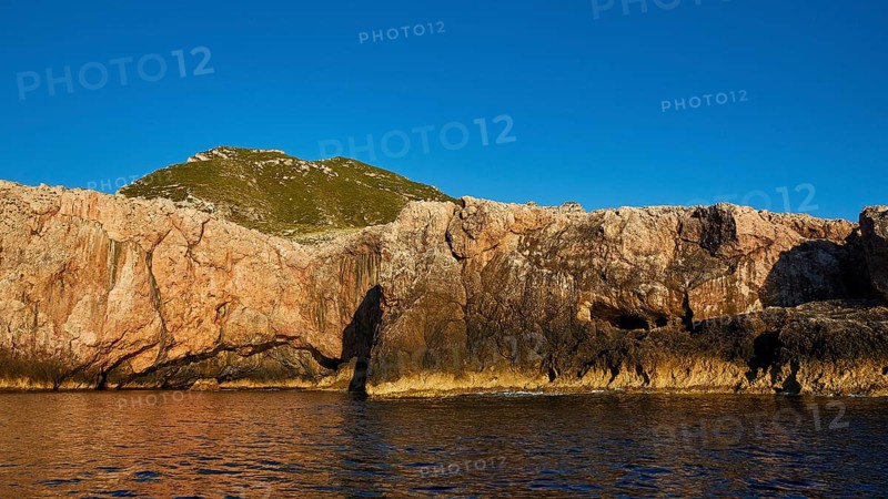 Evening light, Boat tour, View from the sea, Bizarre rock formations, Rugged mountains, Marettimo, Egadi Islands, Sicily, Italy, Europe
