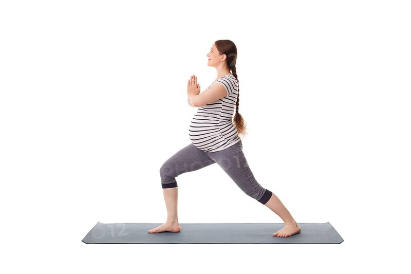 Pregnancy yoga exercise, pregnant woman doing asana virabhadrasana 1, warrior pose isolated on white background