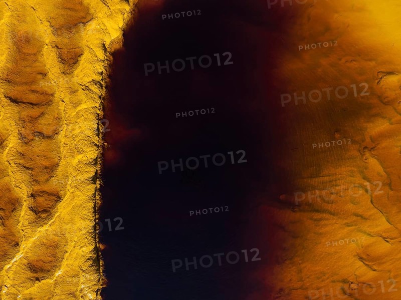 Detail of the Rio Tinto (Red river) with its deep reddish hue due to oxidised iron minerals in its water, aerial view, drone shot, Huelva province, Andalusia, Spain, Europe