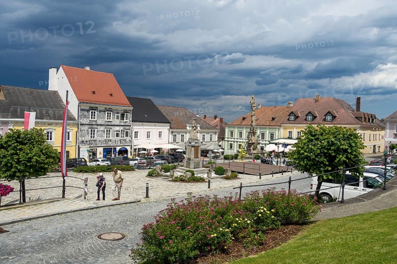 Town hall square with storm clouds and sgraffito house, Weitra, Lower Austria, Austria, Europe