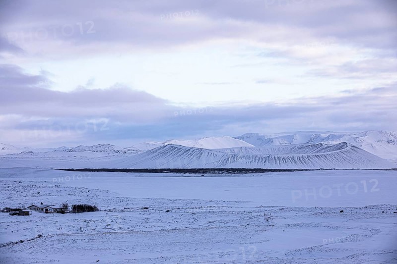 Snow-covered extinct volcano Hverfjall at blue hour, near Lake Myvatn, Northern Ireland Eyestra, Iceland, Europe