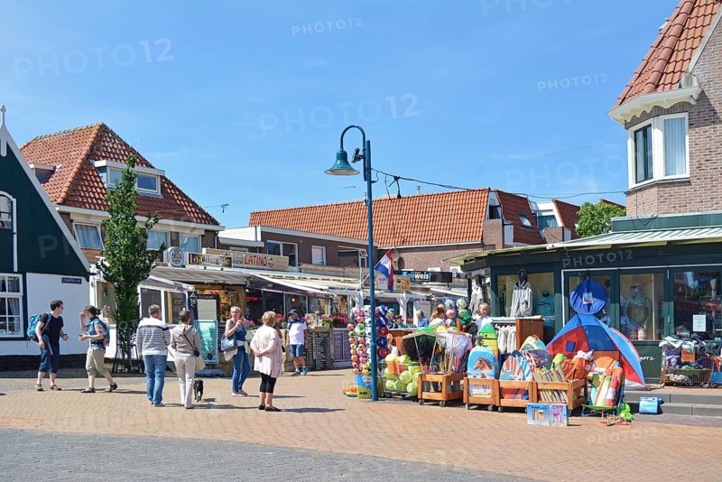 De Koog, Netherlands June 5. 2017 Popular city center with small tourist shops in De Koog on the island Texel in the Netherlands crowded with many visitors on a sunny day