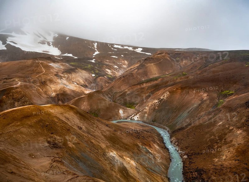 Steaming streams between colourful rhyolite mountains in the Hveradalir geothermal area, Kerlingarfjöll, Icelandic Highlands, Iceland, Europe
