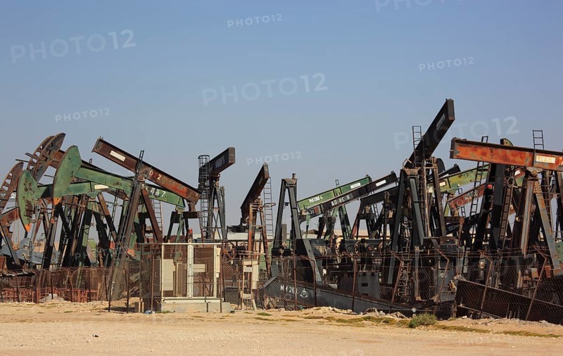 Storage with disused oil pumps near Marmul, Oman, Asia