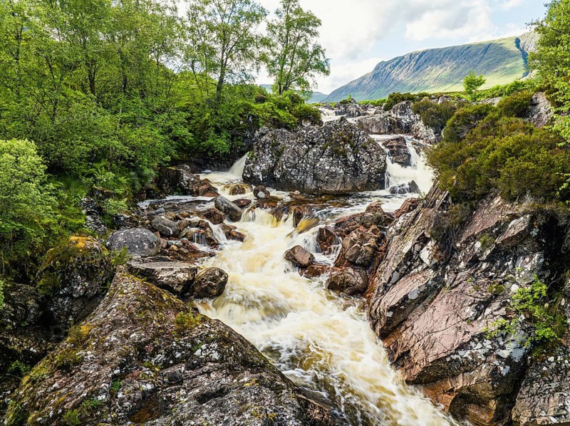 Waterfall on River Coupall from a drone, Buachaille Etive Mor, Glen Etive and River Etive, Highlands, Scotland, UK