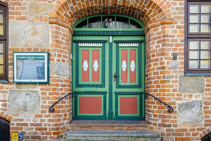 Historic door richly decorated with ornamentation and carvings of the heritage-protected building Fährstraße 11, dating from 1602, today a Baptist parish hall, UNESCO World Heritage Site, Hanseatic City of Stralsund, Mecklenburg-Western Pomerania, Germany, Europe