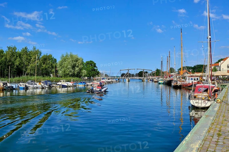 Picturesque view of Greifswald Wieck town harbour with historic wooden bascule bridge over the river Ryck, Hanseatic town of Greifswald, Mecklenburg-Western Pomerania, Germany, Europe
