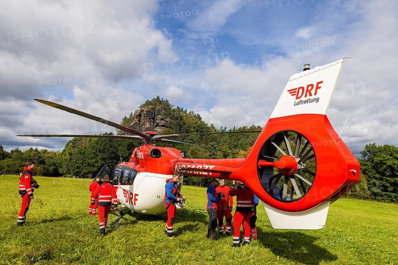 Winch rescue training of the rescue helicopter, Christoph 62, on the occasion of the 50th anniversary of the DRF Luftrettung. The rescue of casualties in the Elbe Sandstone Mountains will be practised
