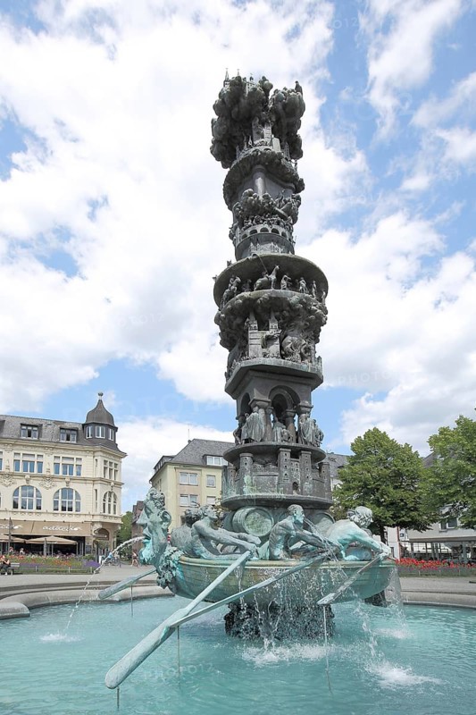 Fountain with sculptures and figures, rowing boat with oarsman and history column, obelisk, Görresplatz, Old Town, Koblenz, Rhineland-Palatinate, Upper Middle Rhine Valley, Germany, Europe
