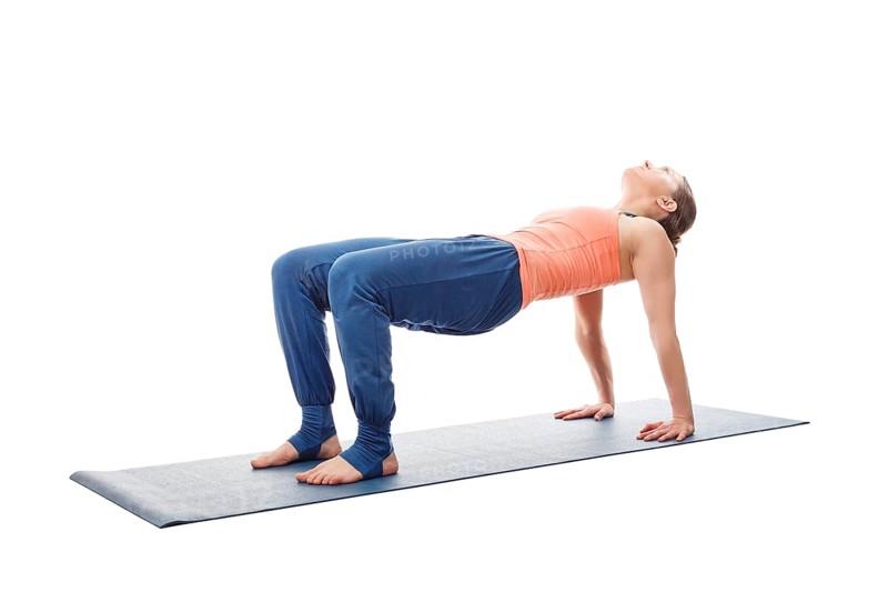Woman doing Ashtanga Vinyasa Yoga asana Purvottanasana, upward-facing plank pose posture easy variation isolated on white background