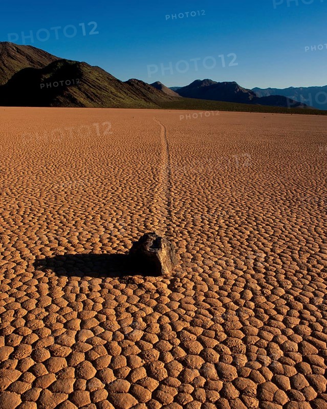 Stone on dried-out earth, Racetrack Valley, Death Valley, California, USA, North America