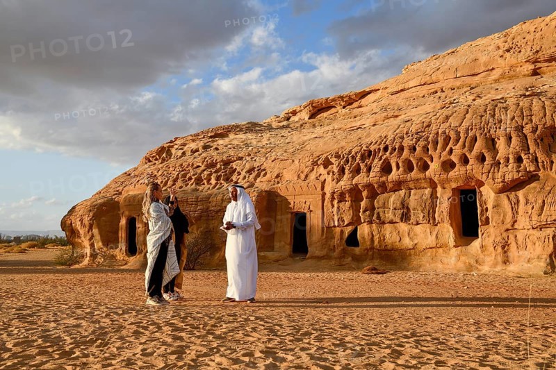 Tourists in front of the Nabataean tombs at the rock Qasr Al-Bint, Hegra or Mada'in Salih, AlUla region, Medina province, Saudi Arabia, Arabian Peninsula, Asia