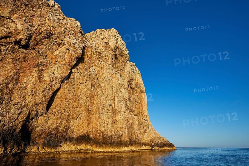 Morning light, Boat tour, View from the sea, Bizarre rock formations, Rugged mountains, Marettimo, Egadi Islands, Sicily, Italy, Europe