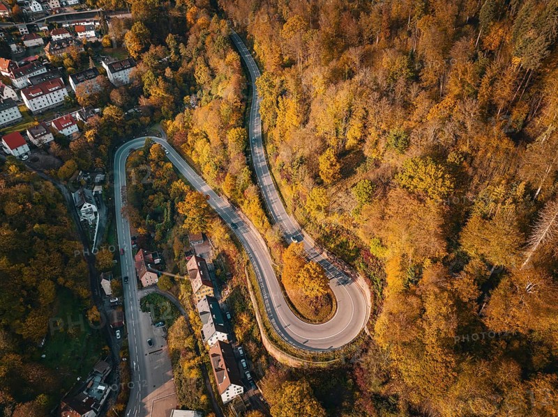 Aerial view S-curve in autumn, Calw, Black Forest Germany