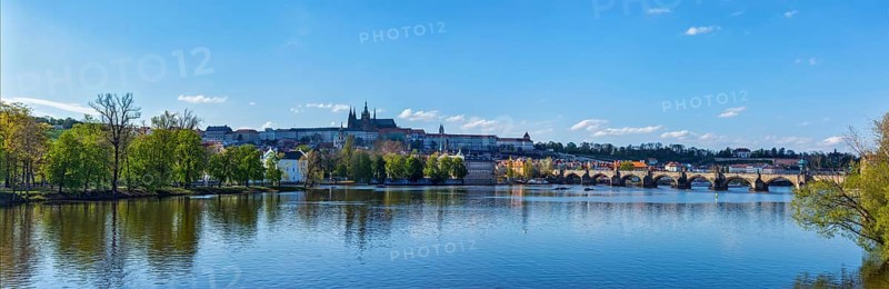 Panorama view of Charles bridge over Vltava river and Gradchany (Prague Castle) and St. Vitus Cathedral in the Prague, Czech Republic, Europe
