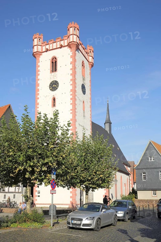 Historic fortified defence tower in front of St. Johann Baptist Church, Kardinal Volk Platz, Steinheim, Hanau, Hesse, Germany, Europe