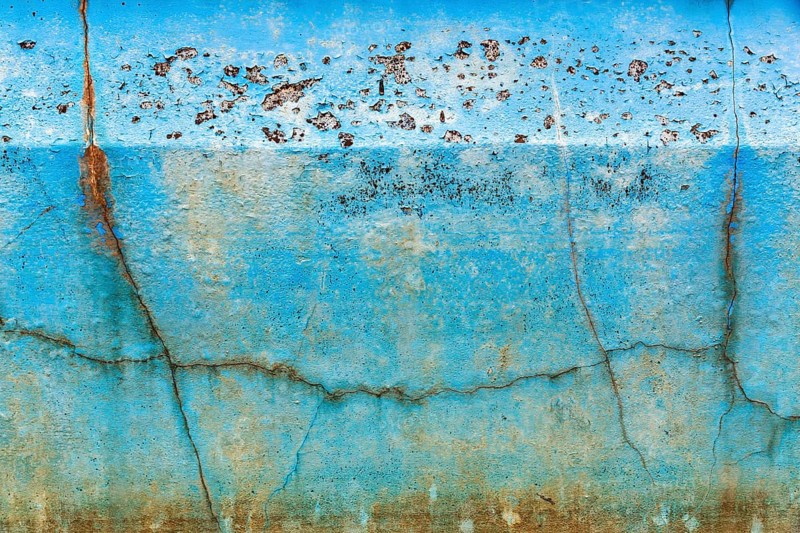 Dirty broken wall in a swimming pool, cracks, peeling blue colour, dilapidated swimming pool, lost place, full-frame, Spain, Europe