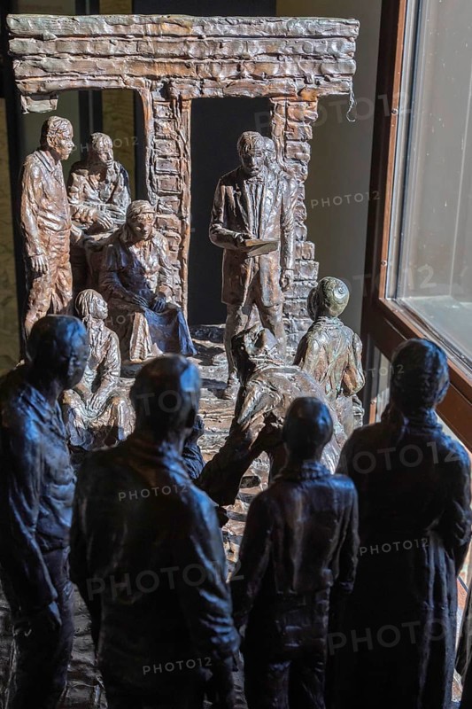 Hardy, Virginia, Booker T. Washington National Monument. A sculpture by Lloyd Lilly in the visitor center shows the moment that slaves were freed on the former James Burroughs plantation. Washington was born a slave on the plantation in about 1856 and was freed from slavery in 1865. He went on to found the Tuskegee Institute