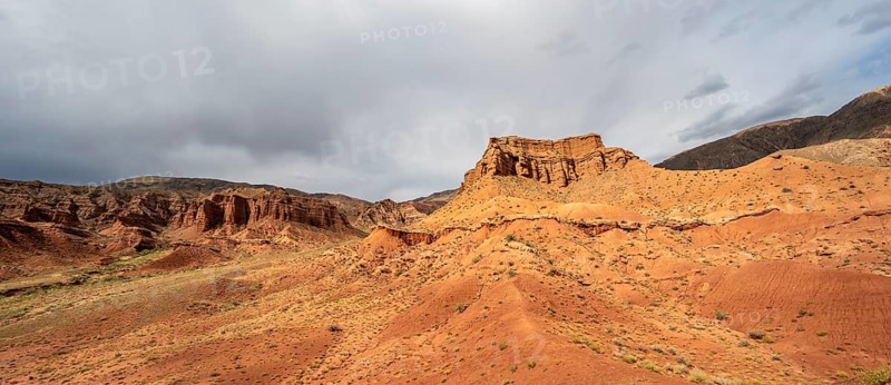 Eroded mountain landscape with sandstone cliffs, red and orange rock formations, Konorchek Canyon, Chuy, Kyrgyzstan, Asia