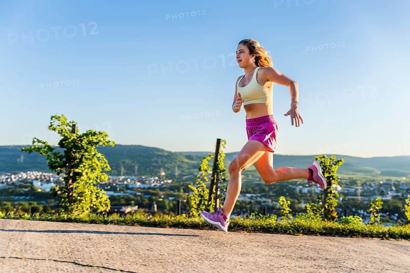 Young woman in Fitness training, vineyard at Grossheppach, Remstal valley, Baden Württemberg, Germany, Europe