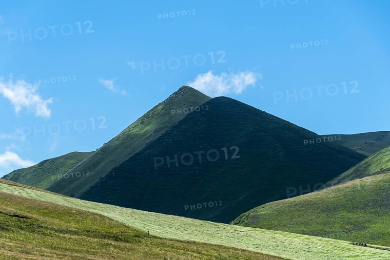 The Monts Dore. Regional park of the Auvergne volcanoes. The Puy de Monne and in the background the Puy Barbier at the Croix Morand pass, Puy de Dome department. Auvergne Rhone Alpes. France