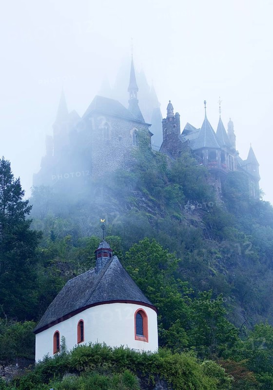 Plague Chapel St. Rochus and Reichsburg Castle in the fog in the early morning, Cochem, Rhineland-Palatinate, Germany, Europe