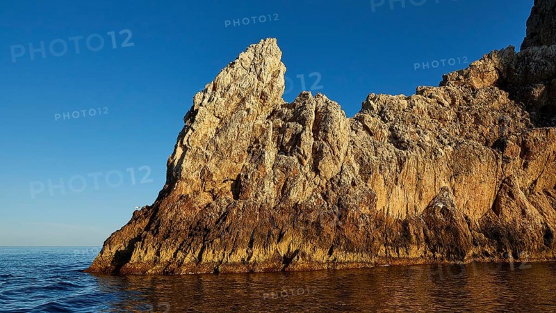 Evening light, Boat tour, View from the sea, Bizarre rock formations, Rugged mountains, Marettimo, Egadi Islands, Sicily, Italy, Europe