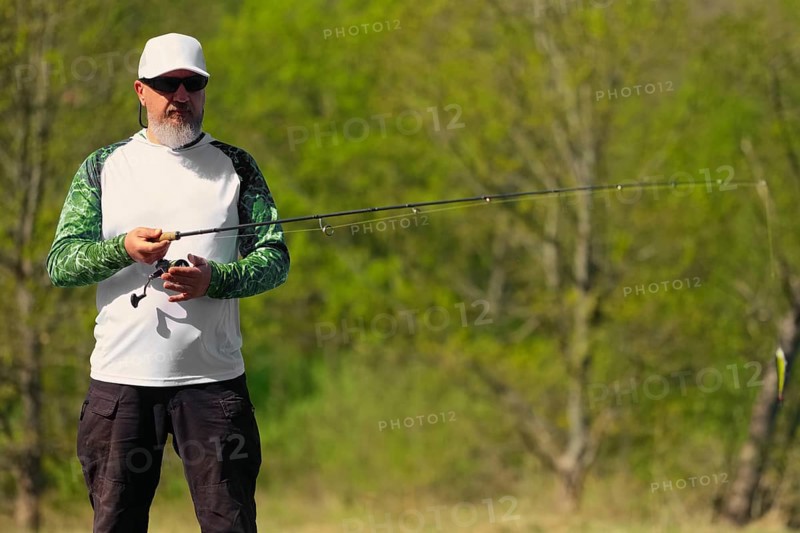 Fisherman with rod ready to make a cast
