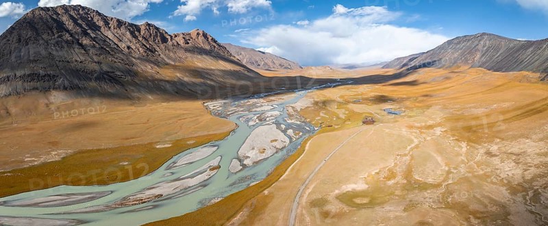 Aerial view, Burkhan mountain valley with meandering river, barren dramatic mountain landscape, Terskey Ala-Too, Tien Shan, Issyk Kul province, Kyrgyzstan, Asia
