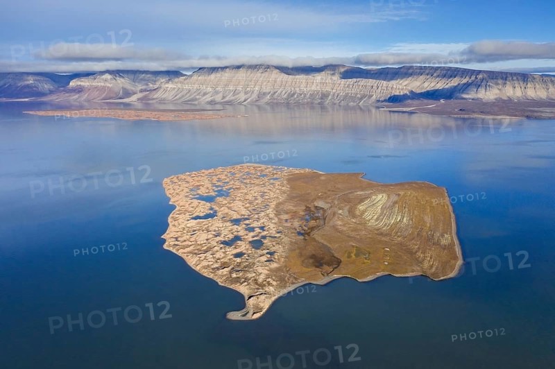Aerial view over Flintholmen, small island in Ekmanfjorden, fjord in the Nordre Isfjorden National Park in summer, Nordfjorden, Spitsbergen, Norway, Europe