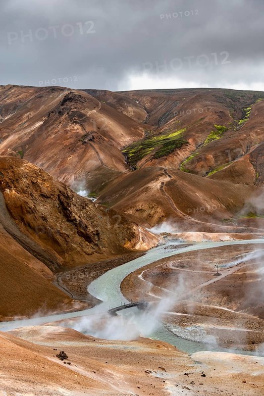 Bridge and steaming streams between colourful rhyolite mountains in the Hveradalir geothermal area, Kerlingarfjöll, Icelandic Highlands, Iceland, Europe