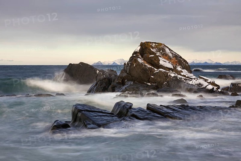 Rocks in the surf along the coast of Gimsoy, Gimsøy, Austvagoya, Austvågøy, Lofoten archipelago, Norway, Europe