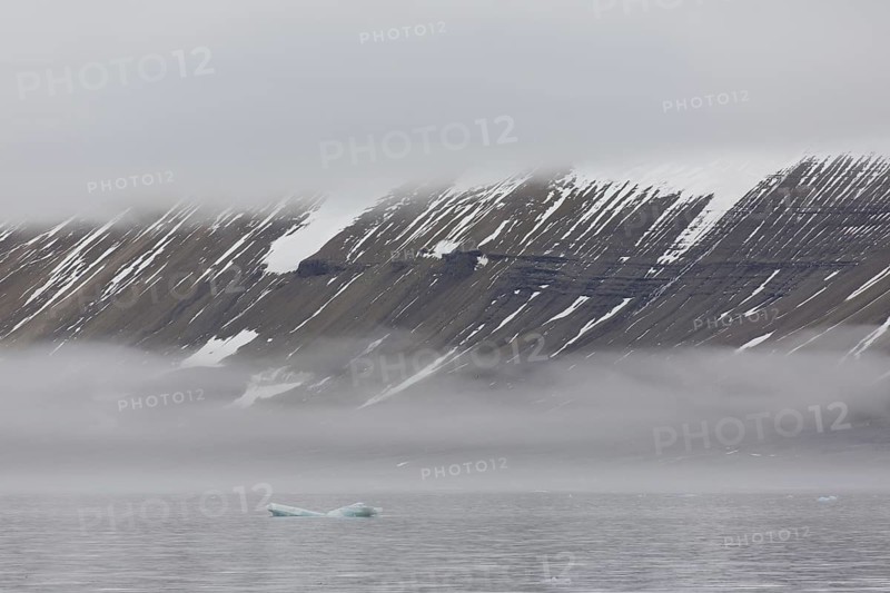 Mountains in the fog along the coast at Hinlopenstretet, Hinlopenstreet, Hinlopen strait between Spitsbergen and Nordaustlandet in Svalbard, Norway, Europe