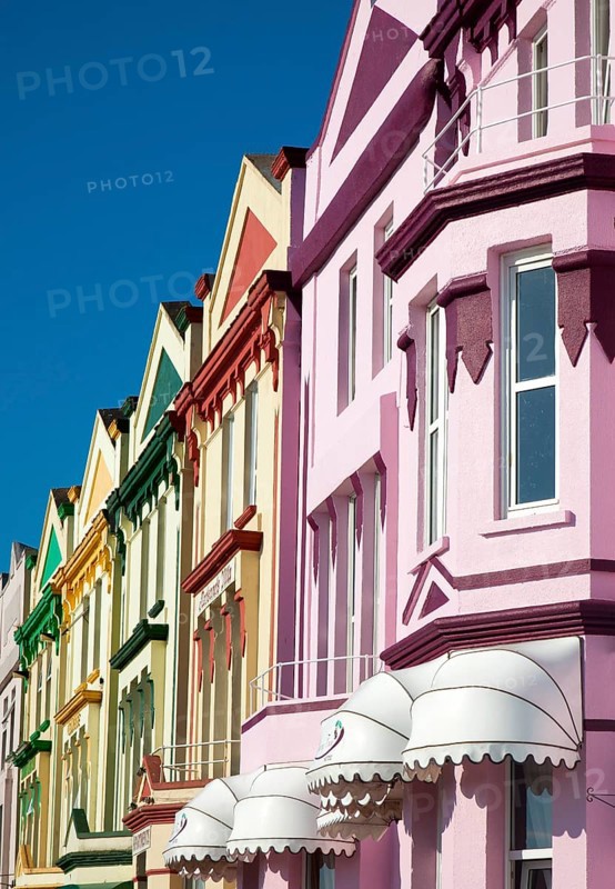 Colourfully painted guesthouses and hotels on the Esplanade, Paignton, Devon, England, United Kingdom, Europe