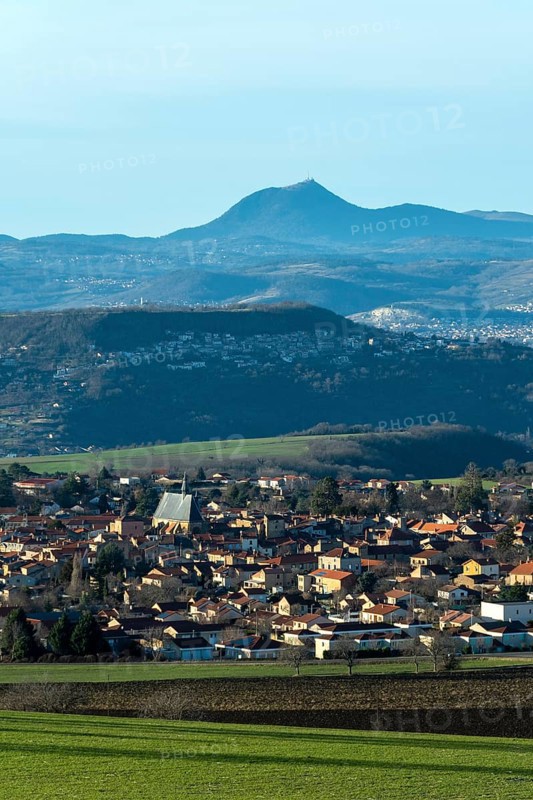 View on Vic le Comte village, Puy de Dome volcano in background, Limagne plain, Puy de Dome department, Auvergne Rhone Alpes, France, Europe