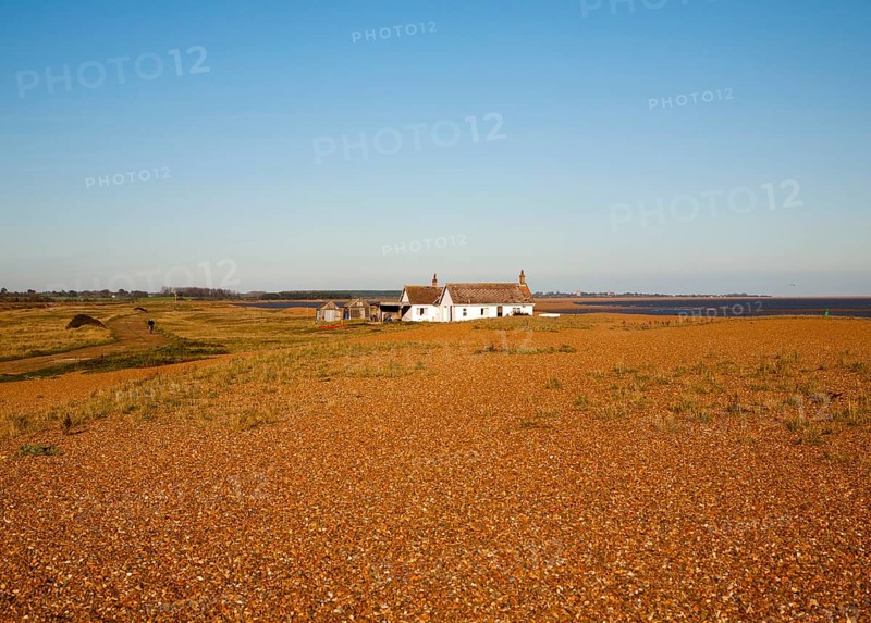 Seaside bungalow on shingle beach near North Weir Point, Shingle Street, Suffolk, England, UK